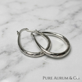 Aretes de argolla en forma de lágrima martillados de plata de ley