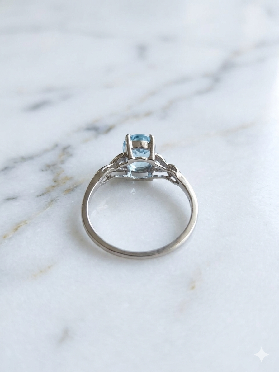10K White Gold Oval Blue Topaz Ring